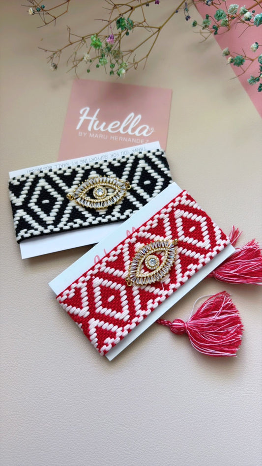 Juego de dos pulseras tejidas Ojo